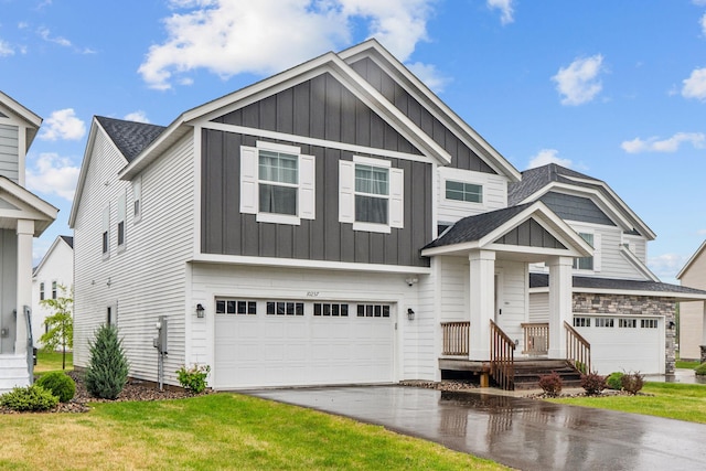 10257 Greenway Cir S, Cottage Grove, MN 55016 - craftsman-style house with board and batten siding, a garage, asphalt driveway, a front lawn, and a shingled roof