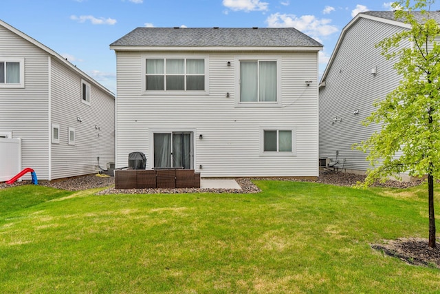 10257 Greenway Cir S, Cottage Grove, MN 55016 - back of house featuring an outdoor hangout area, a lawn, central air condition unit, and a shingled roof