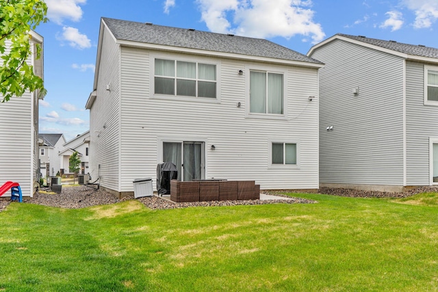 10257 Greenway Cir S, Cottage Grove, MN 55016 - rear view of property featuring outdoor lounge area, a lawn, and central AC unit