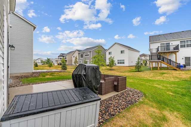 10257 Greenway Cir S, Cottage Grove, MN 55016 - view of green lawn featuring a residential view, a wooden deck, stairs, and a patio
