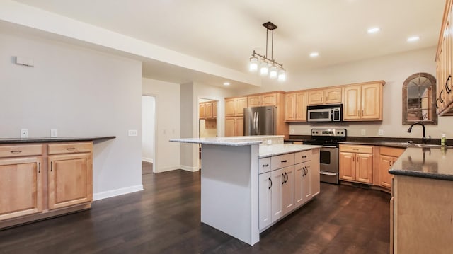 3219 Anric Dr, Eau Claire, WI 54701 - kitchen featuring light brown cabinetry, appliances with stainless steel finishes, recessed lighting, and a sink