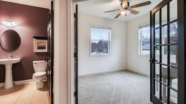 3219 Anric Dr, Eau Claire, WI 54701 - bathroom with baseboards, a ceiling fan, a sink, and toilet