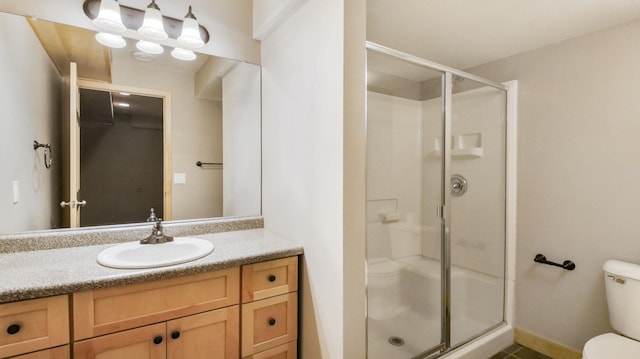 3219 Anric Dr, Eau Claire, WI 54701 - full bathroom featuring vanity, a stall shower, and toilet