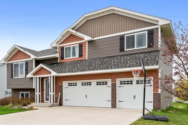 view of front of property with a garage, a shingled roof, and driveway
