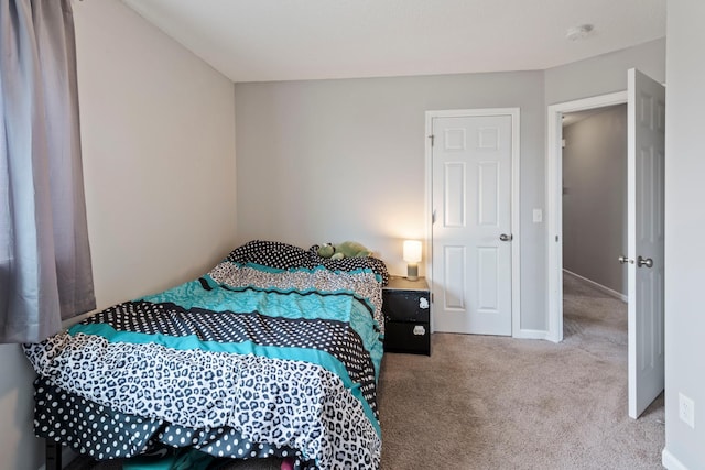 carpeted bedroom with baseboards
