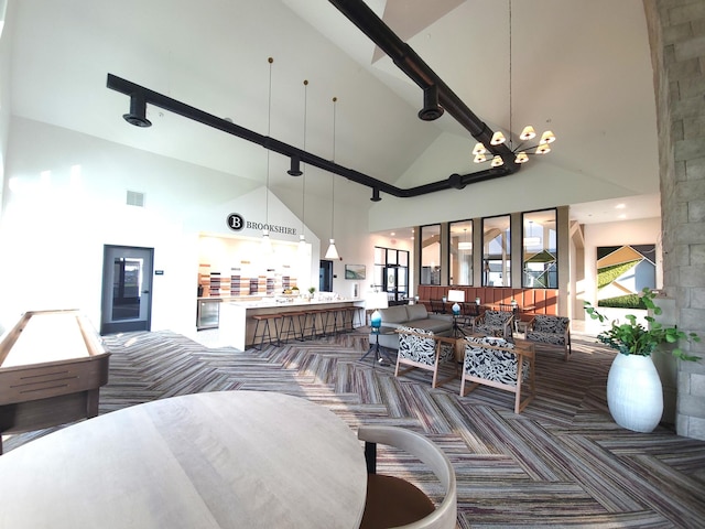 17232 Durham Dr, Lakeville, MN 55044 - interior space featuring visible vents, a notable chandelier, and high vaulted ceiling