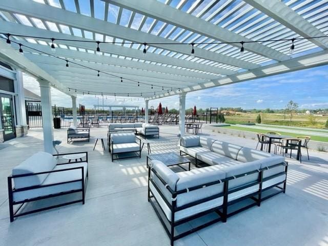 17232 Durham Dr, Lakeville, MN 55044 - view of patio / terrace featuring a pergola, an outdoor living space, and fence