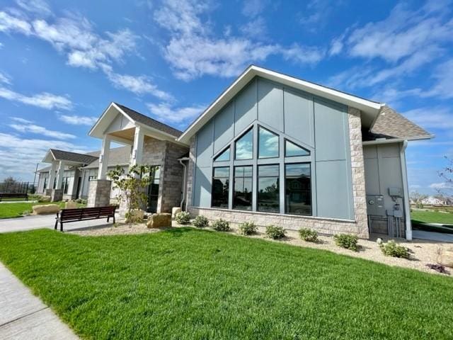 17232 Durham Dr, Lakeville, MN 55044 - exterior space featuring a lawn and stone siding