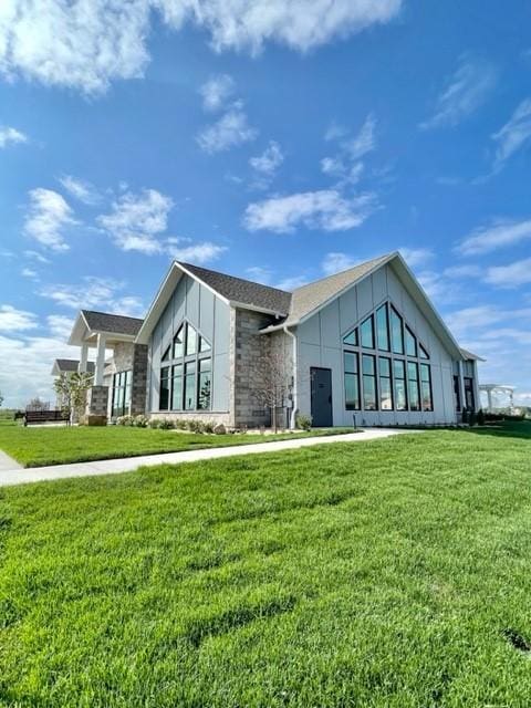 17232 Durham Dr, Lakeville, MN 55044 - exterior space with a yard and stone siding