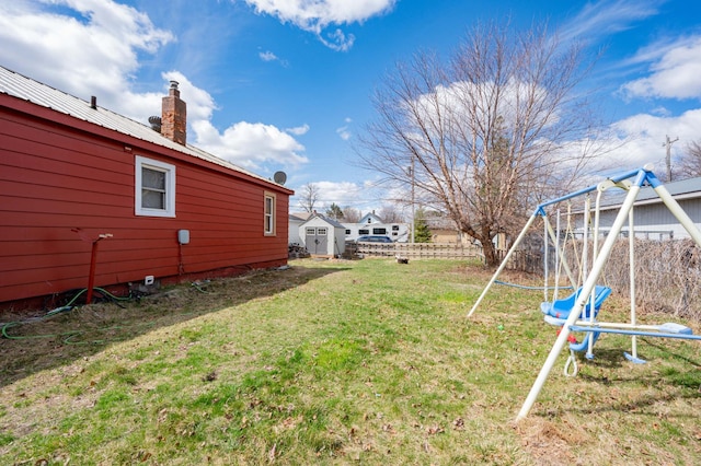 515 6th Ave, Grand Rapids, MN 55744 - view of yard with a storage shed, a playground, and fence