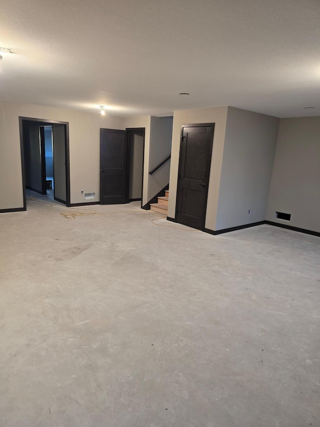 below grade area with baseboards and stairway