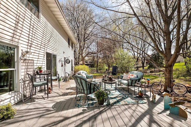 wooden deck with an outdoor hangout area