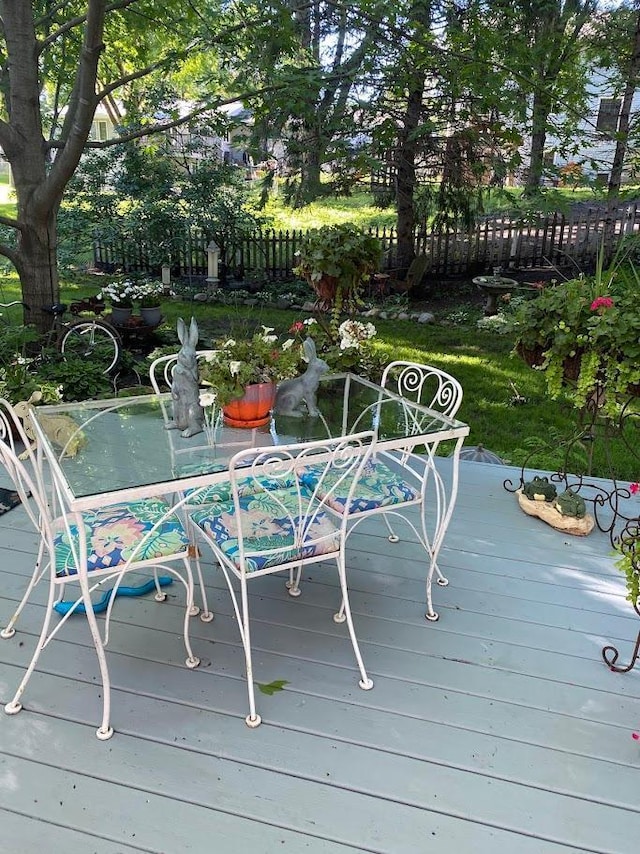 wooden deck featuring fence and outdoor dining area