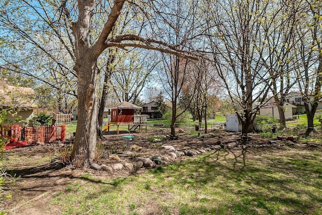 view of yard with a shed and an outbuilding