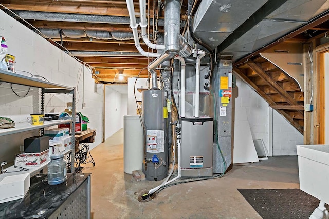unfinished basement featuring heating unit, gas water heater, and concrete block wall