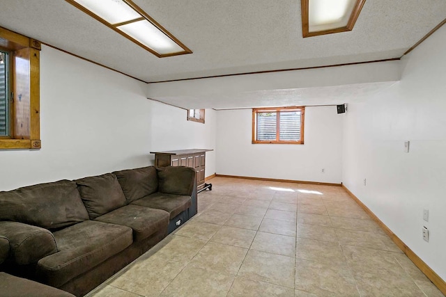 living room with light tile patterned flooring, a textured ceiling, and baseboards