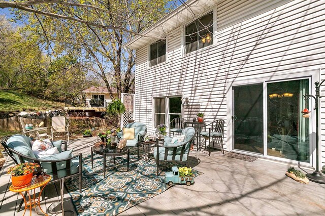 1713 James Pl, Burnsville, MN 55337 - view of patio / terrace featuring an outdoor hangout area and a wooden deck