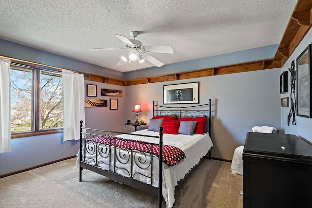 1713 James Pl, Burnsville, MN 55337 - bedroom featuring carpet, baseboards, a textured ceiling, and a ceiling fan