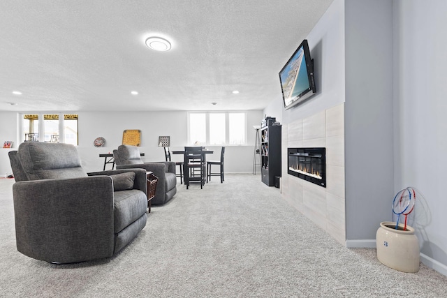 17960 Granite Ct, Lakeville, MN 55044 - living area featuring carpet flooring, a textured ceiling, and a tile fireplace