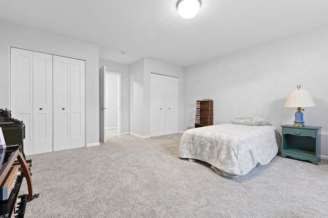 17960 Granite Ct, Lakeville, MN 55044 - bedroom with baseboards, multiple closets, and carpet