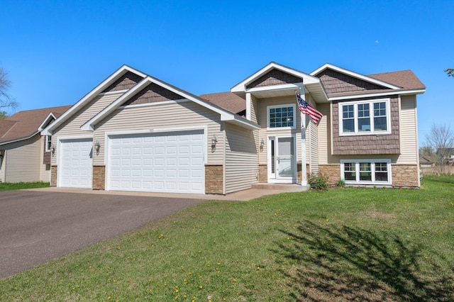 craftsman house with a front lawn, stone siding, aphalt driveway, and a garage
