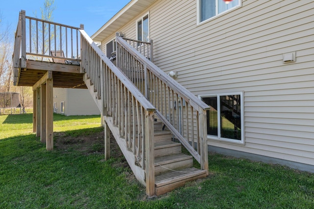 exterior space featuring a lawn and stairs