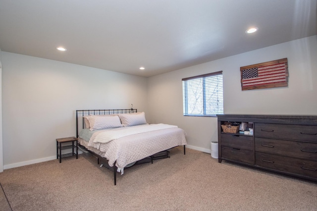 bedroom featuring recessed lighting, baseboards, and light carpet