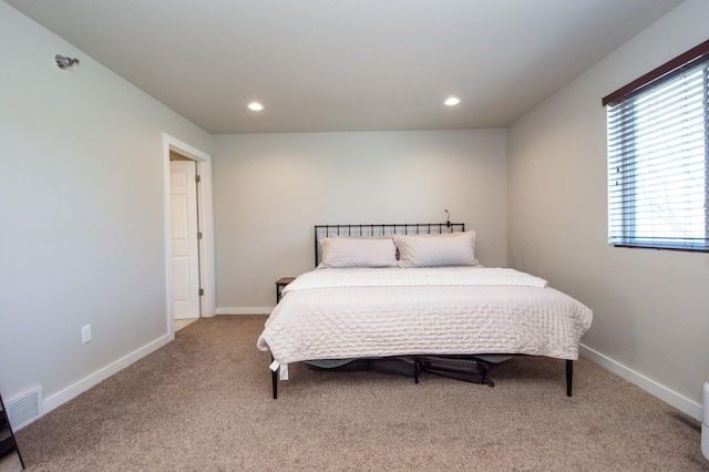 carpeted bedroom with baseboards, recessed lighting, and visible vents