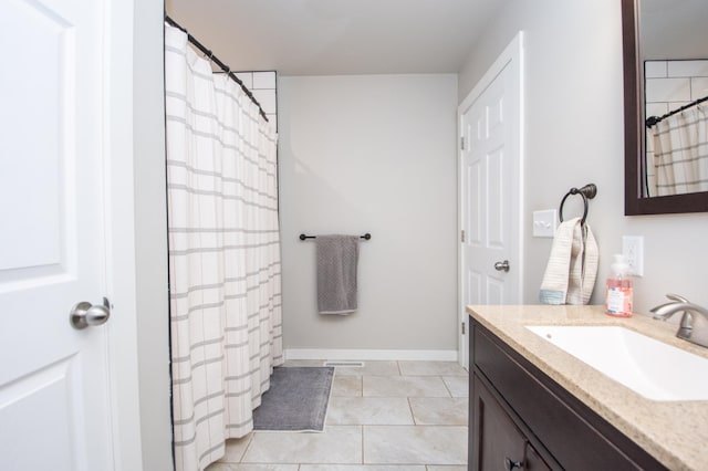 full bathroom with vanity, baseboards, tile patterned floors, and curtained shower