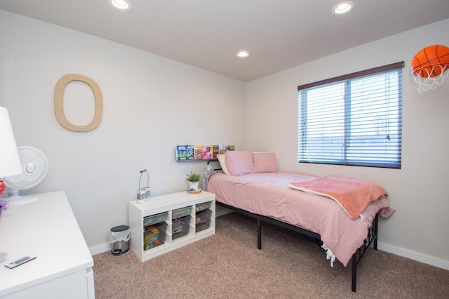 carpeted bedroom featuring baseboards and recessed lighting