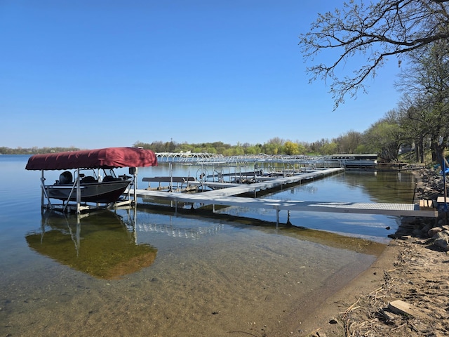 view of dock featuring a water view and boat lift