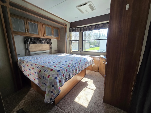 bedroom featuring light colored carpet
