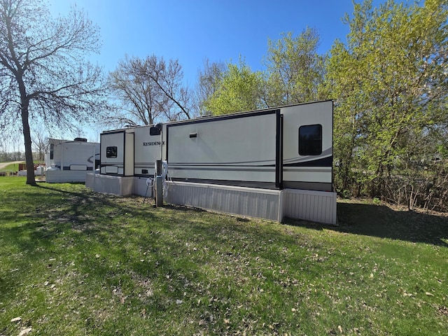 view of side of home featuring a yard