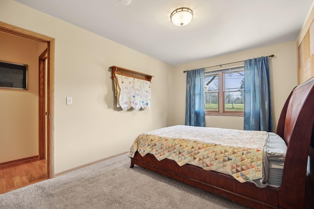 carpeted bedroom with baseboards