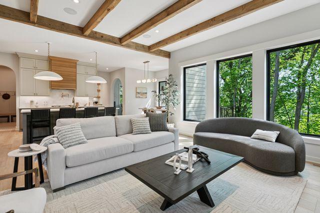 9399 Eagle Ridge Way, Chanhassen, MN 55317 - living room with arched walkways, beam ceiling, and recessed lighting