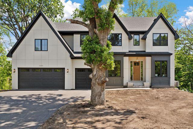 9399 Eagle Ridge Way, Chanhassen, MN 55317 - modern inspired farmhouse with a garage, driveway, board and batten siding, and a shingled roof
