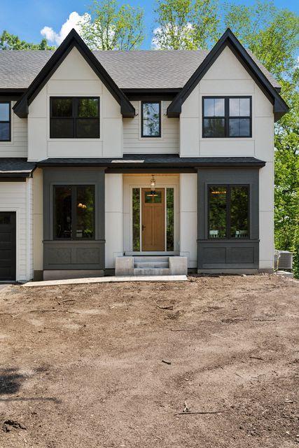 9399 Eagle Ridge Way, Chanhassen, MN 55317 - modern farmhouse style home featuring roof with shingles
