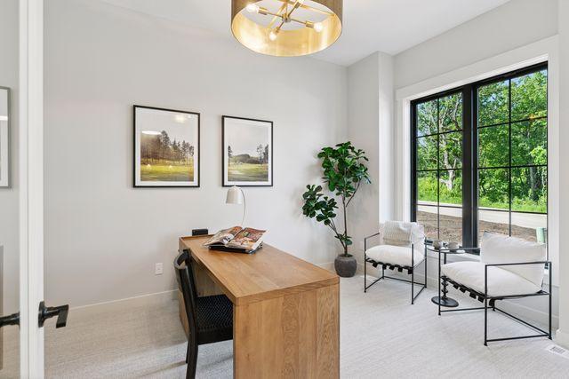 9399 Eagle Ridge Way, Chanhassen, MN 55317 - carpeted office space featuring baseboards and a chandelier