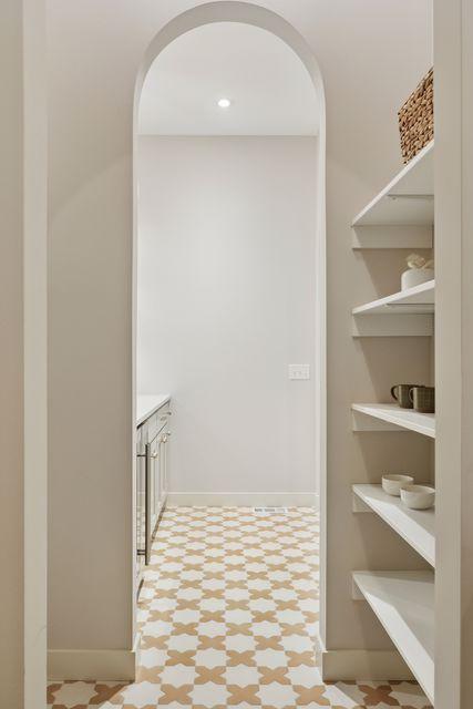9399 Eagle Ridge Way, Chanhassen, MN 55317 - hallway with light floors and arched walkways