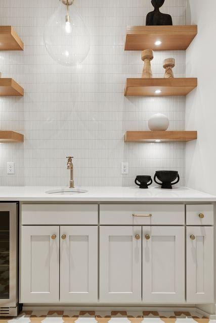 9399 Eagle Ridge Way, Chanhassen, MN 55317 - bar area featuring a sink and beverage cooler