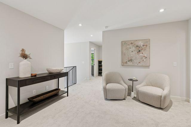 9399 Eagle Ridge Way, Chanhassen, MN 55317 - sitting room featuring carpet floors, an upstairs landing, and recessed lighting
