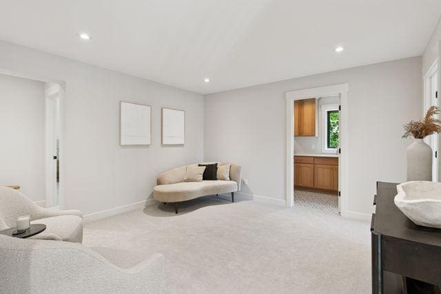 9399 Eagle Ridge Way, Chanhassen, MN 55317 - sitting room with light colored carpet and recessed lighting
