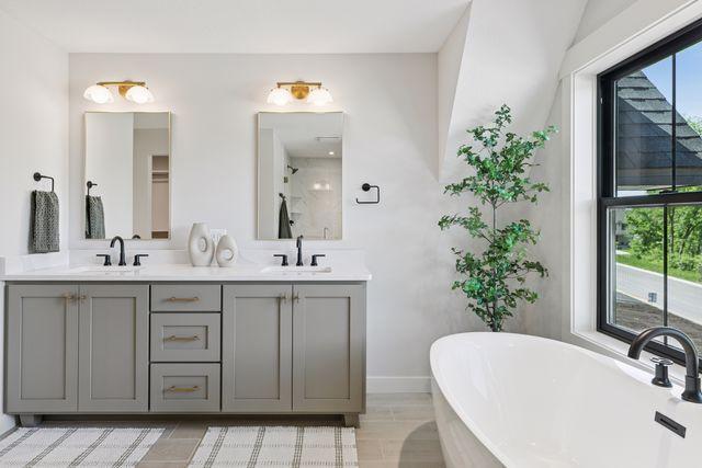 9399 Eagle Ridge Way, Chanhassen, MN 55317 - bathroom with a soaking tub and double vanity