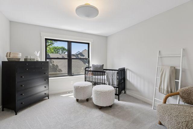 9399 Eagle Ridge Way, Chanhassen, MN 55317 - bedroom featuring light colored carpet and baseboards