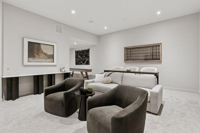 9399 Eagle Ridge Way, Chanhassen, MN 55317 - cinema room featuring light carpet and recessed lighting