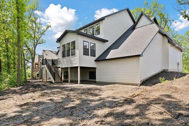 9399 Eagle Ridge Way, Chanhassen, MN 55317 - back of house with stairway, a wooden deck, and a shingled roof