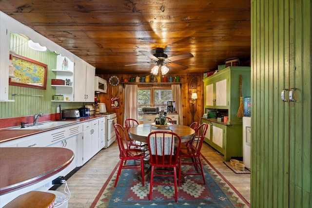 dining room featuring a toaster, wooden ceiling, ceiling fan, and light wood-type flooring