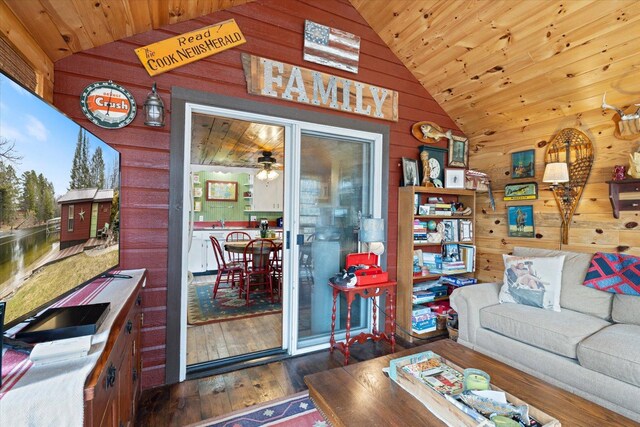 living area featuring wooden ceiling, ceiling fan, wood walls, and wood finished floors