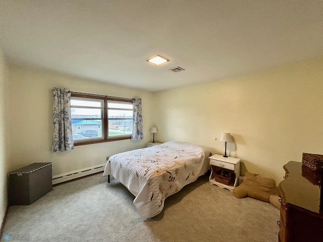 bedroom featuring visible vents, a baseboard radiator, and carpet flooring