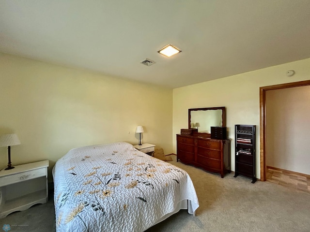 carpeted bedroom with visible vents